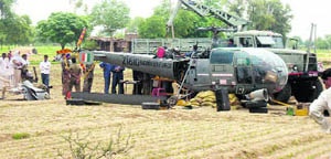 The IAF chopper that made an emergency landing near Chindhar in Fatehabad being repaired on Monday. 