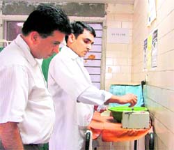 PPCB officials check the needle destroyer at ESI Model Hosiptal, in Ludhiana