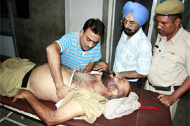 The injured warder being attended to by doctors at the hospital in Bathinda on Tuesday.