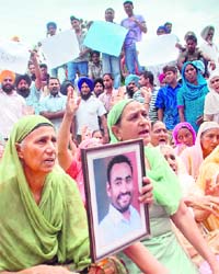 Kumbhra residents protest against police inaction in front of the Deputy Commissioners office in Mohali