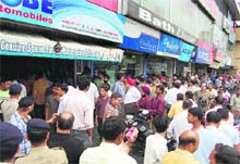 MDDA officials seal a shopping complex in Dehradun on Tuesday. 
