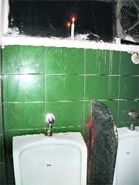 A candle lit in a lavatory below Jawahar Aquarium on the Mall Road in Mussoorie.