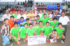 The Uttarakhand Police team with the trophy after winning the District Football League in Dehradun on Tuesday. 
