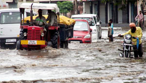 Jalandhar woke up to heavy rains in the morning on Tuesday. Within hours, several streets in the city were inundated leaving commuters a troubled lot.