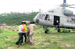 Persons who were trapped on an island after flashfloods in the Tawi being rescued by the Army