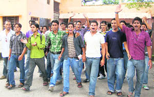 DAV (PG) College students raise slogans in Dehradun on Wednesday.