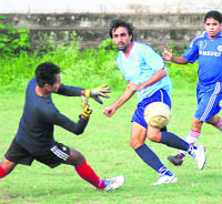 A match in the Nemidass District Super League at the Pavilion Ground in Dehradun on Wednesday.