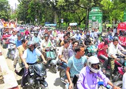 Uttarakhand Kranti Dal workers take out a rally in Dehradun on Wednesday. 