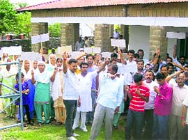 Family members and villagers holding a protest against the railway 