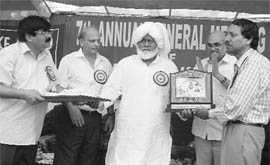Chief Parliamentary Secretary (Wakf) gives Khwaja Altaf Hussain Hali Award to Urdu poet Mohd Sultan Anjum during the annual general meeting of the Haryana Wakf Board in Ambala Cantonment on Thursday.