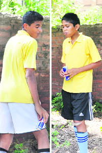 Footballers consume an energy drink during a break in their Pre-Subroto mach at GMSSS-22 in Chandigarh.