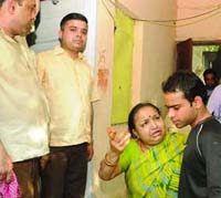 Relatives of the victim, Meenakshi, in New Delhi