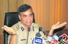 Uttarakhand DGP Jyoti Swaroop Pandey addresses a press conference after taking over in Dehradun on Thursday. 