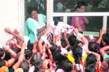 Amarnath yatris wait to get accommodation at the Yatri Niwas base camp in Jammu on Thursday. The yatra was suspended for the second consecutive day due to bad weather. 