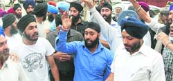 Members of the Sikh community hold a demonstration in Srinagar on Thursday. 
