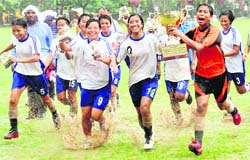 Manipur girls in a jubilant mood after winning the Junior Football National for Girls in Chandigrah on Friday.