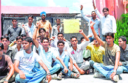 SMJN College students hold a protest after forcing the closure of the college in Haridwar