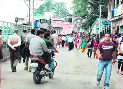 A biker in No Vehicle Zone driving in Lakkar Bazaar at Shimla 