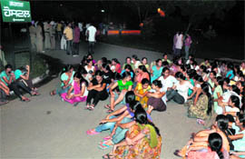Students during their night-long sit-in outside a PAU hostel in Ludhiana.
