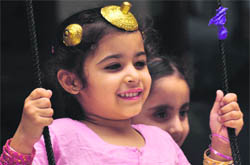 A kid enjoys the Festival of Swings at Guru Nanak Public School, Ludhiana, on Friday.