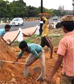 Labourers work ahead of the Commonwealth Games at 