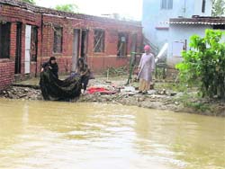 A flooded campus of HESCO at Shuklapur village near Dehradun on Saturday.