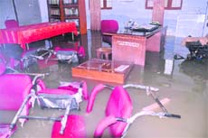 A flooded office at the Government Inter-college at Ajabpur Kalan in Dehradun on Saturday. 