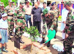 Major-General Om Prakash, SM, GOC 25, Infantry Division, along with other Army officers take part in the plantation drive in Rajouri on Saturday.