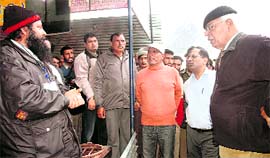 Governor NN Vohra talks to pilgrims during a visit to the Amarnath cave shrine and Panjtarni camp on Saturday.