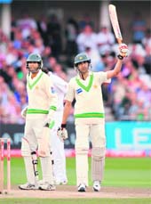 Pakistans Umar Gul (R) celebrates after reaching his half century during the first Test at Trent Bridge in Nottingham on Saturday