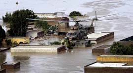 An army helicopter evacuates stranded villagers in Nowshera on Saturday.