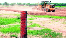Heavy machinery being used to lay a 200-ft-wide road to link Aerocity with Mohali.