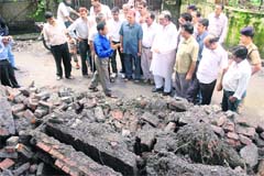 Tehri Garhwal Congress MP Vijay Bahuguna visits a flood-affected area in Dehradun on Sunday.