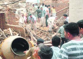 A view of the building where the RCC slab caved in at Fatehabad