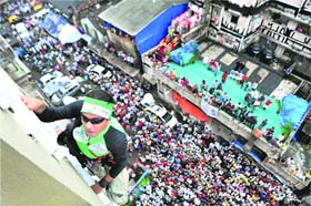 Climber Gaurav Sharma scales the wall of a 17-storey building to create awareness about water conservation and tree plantation in Mumbai on Sunday.