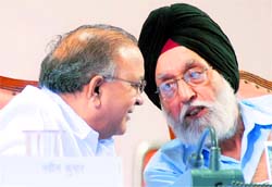Union Minister for Urban Development S Jaipal Reddy (L) speaks to Union Sports Minister M S Gill during the inauguration of the Weightlifting Stadium at Jawaharlal Nehru Sports Complex, in New Delhi on Sunday