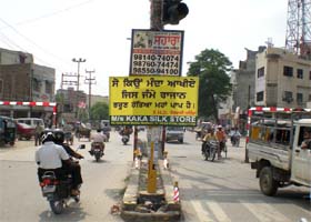 A placard bearing a message to check female foeticide, installed on a traffic light pole on the Mall road in Bathinda