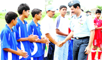 Air Commodore Rajeev Sachdeva meets players before a football match at Air Force Station in Chandigarh on Monday. A Tribune photograph