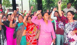 Residents of Gajvadi village protest at the office of the District Magistrate in Dehradun on Monday.