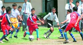 Players in action at the SGRR Sahodaya Complex Sub-Junior Football Tournament in Dehradun on Monday.