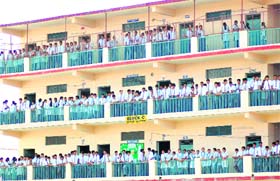 Students of SGRR School, Race Course, enjoy a football match from the corridors of their school in Dehradun on Monday.