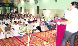 Deputy Commissioner Ajit Joshi speaks at a seminar on Water Conservation in Sonepat.