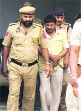 Sangram Singh, the main accused in the Chopra murder case, being produced in a Jammu court on Monday