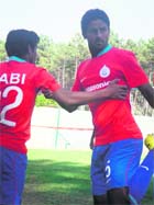 Anwar (R) and Syed Rahim Nabi train in Portugal