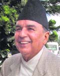 Nepali Congress leader Ram Chandra Poudel, who is running a caretaker government, walks into the constituent assembly building in Kathmandu on Monday.