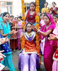 Students and teachers of Khalsa College for Women celebrate Teej in Amritsar.