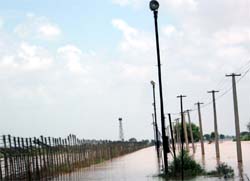 The fencing and floodlights are under four to five feet deep water near the Zero Line in the Anoopgarh sector