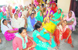 Sanitary workers of the Dehradun Municipal Corporation stage a dharna in the city