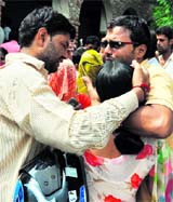 Wailing family members of a youth, who was killed in a an accident in Uttarkashi, at his cremation at Baghnaki village in Gurgaon on Tuesday.