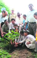 Students and members of the Cantonment Board plant saplings on the premises of Government Model School, Satwari,